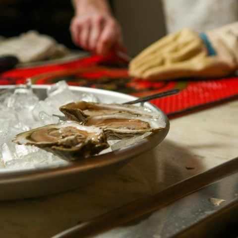 Raw Oysters being shucked