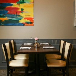 wall art and seating in the dining area